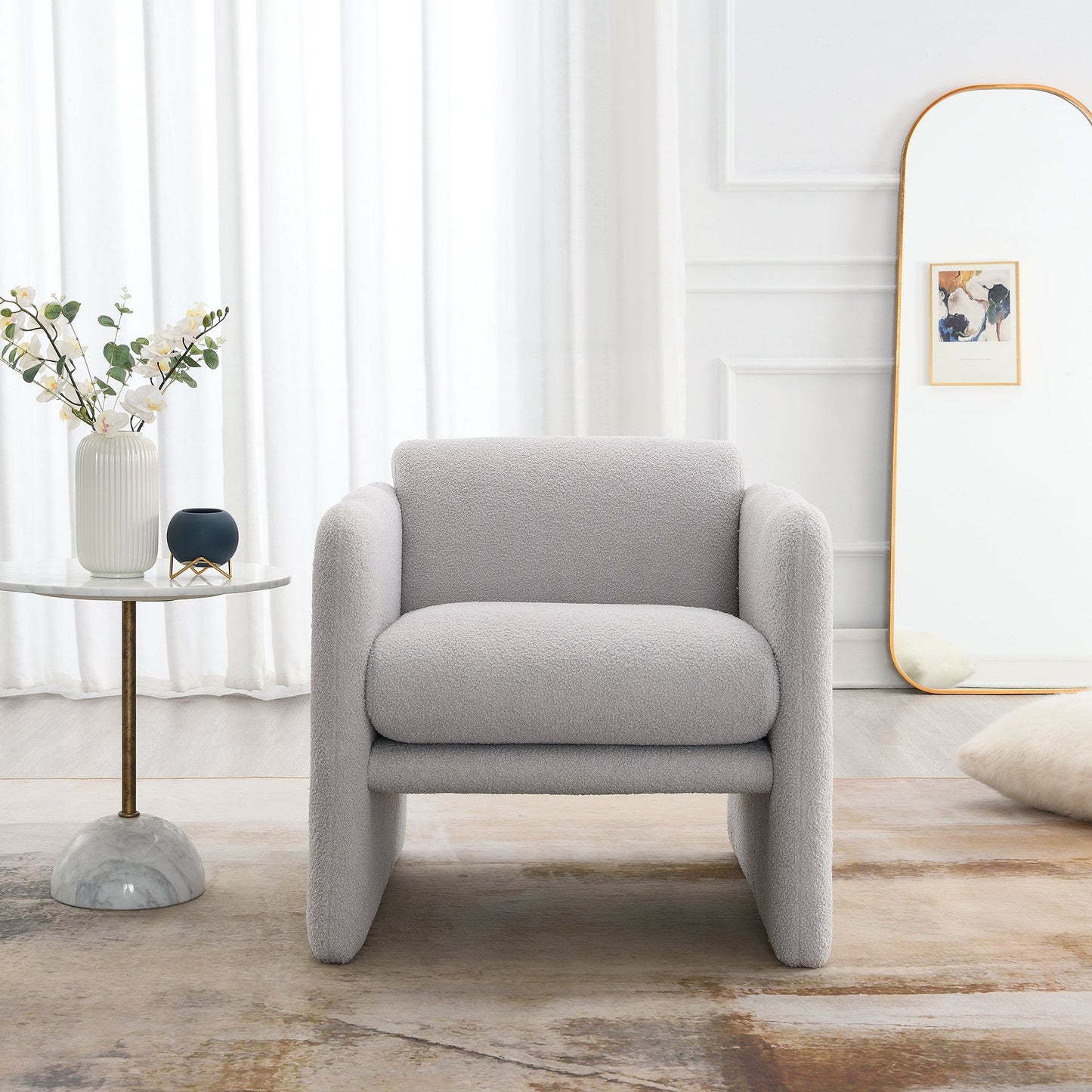 Armchair with wavy armrests, metal decorations on both sides of the armrests, made of Teddy cloth, light gray