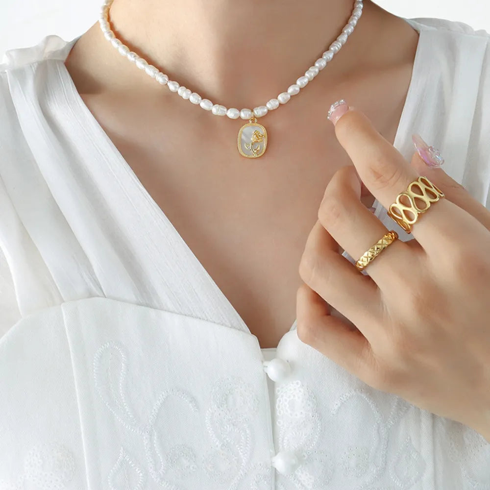 French Baroque freshwater pearl chain oval plate inlaid with zircon colored shell relief flower necklace