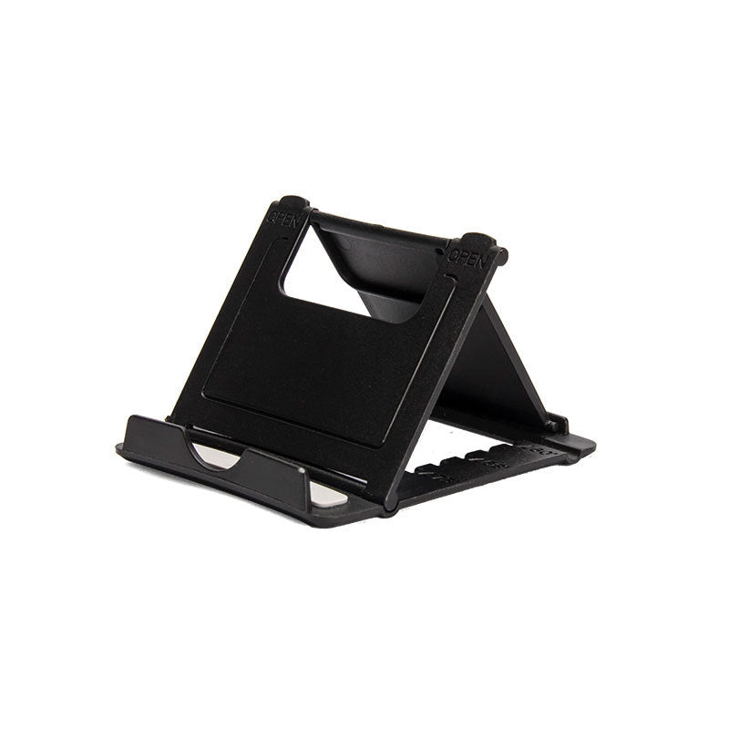 A plastic, foldable cradle for mobile phones