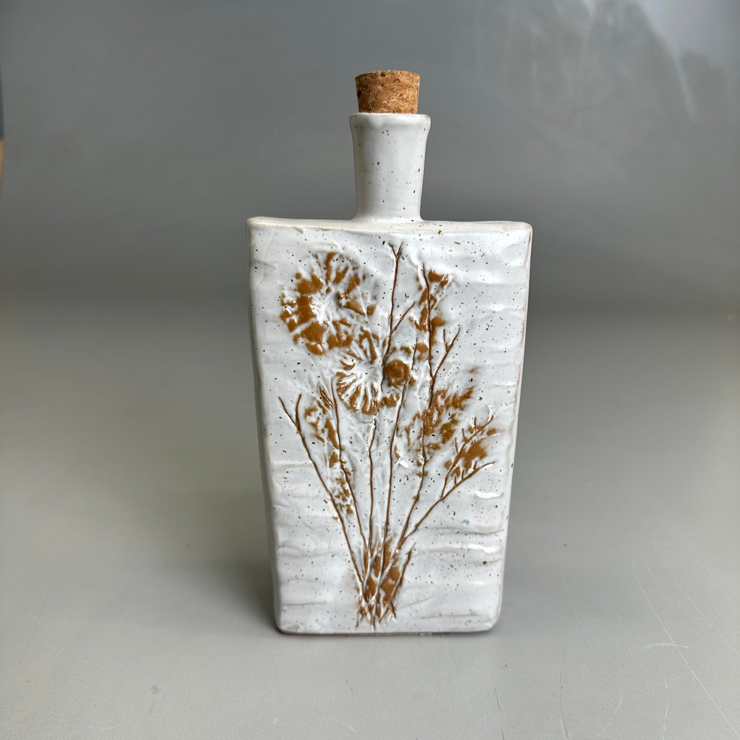8" Embossed Stoneware Bottle w/Flower & Cork Stopper White