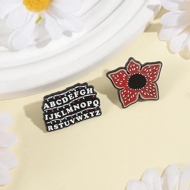 Sci-fi Horror Movies Brooch Enamel Pins Red Cannibal Flowers And 26 English Letter Brooches Backpack Lapel Badge Jewelry Gifts