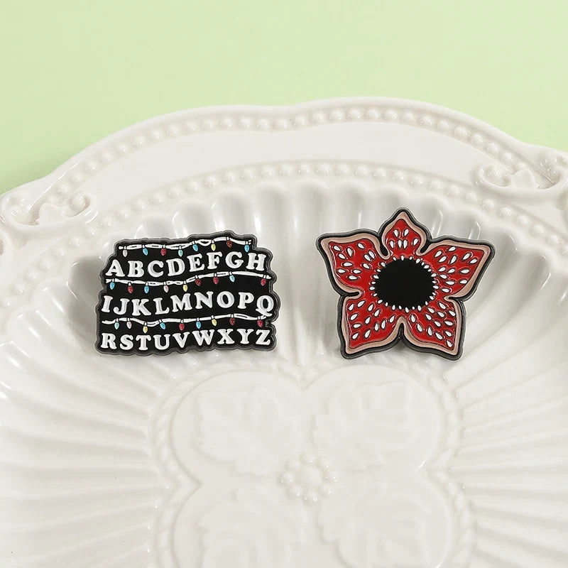 Sci-fi Horror Movies Brooch Enamel Pins Red Cannibal Flowers And 26 English Letter Brooches Backpack Lapel Badge Jewelry Gifts
