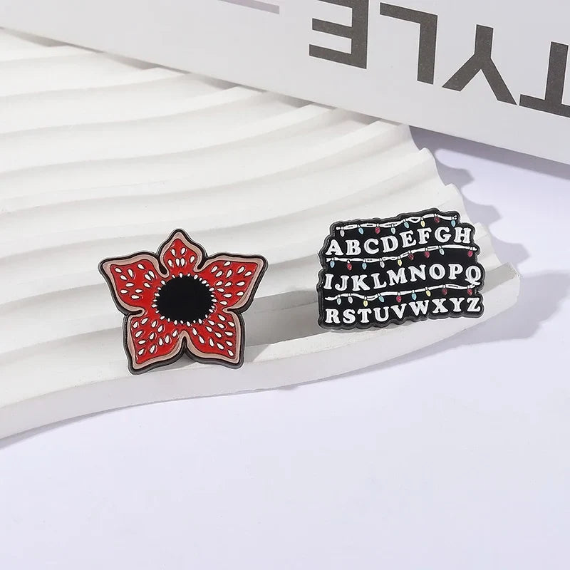Sci-fi Horror Movies Brooch Enamel Pins Red Cannibal Flowers And 26 English Letter Brooches Backpack Lapel Badge Jewelry Gifts